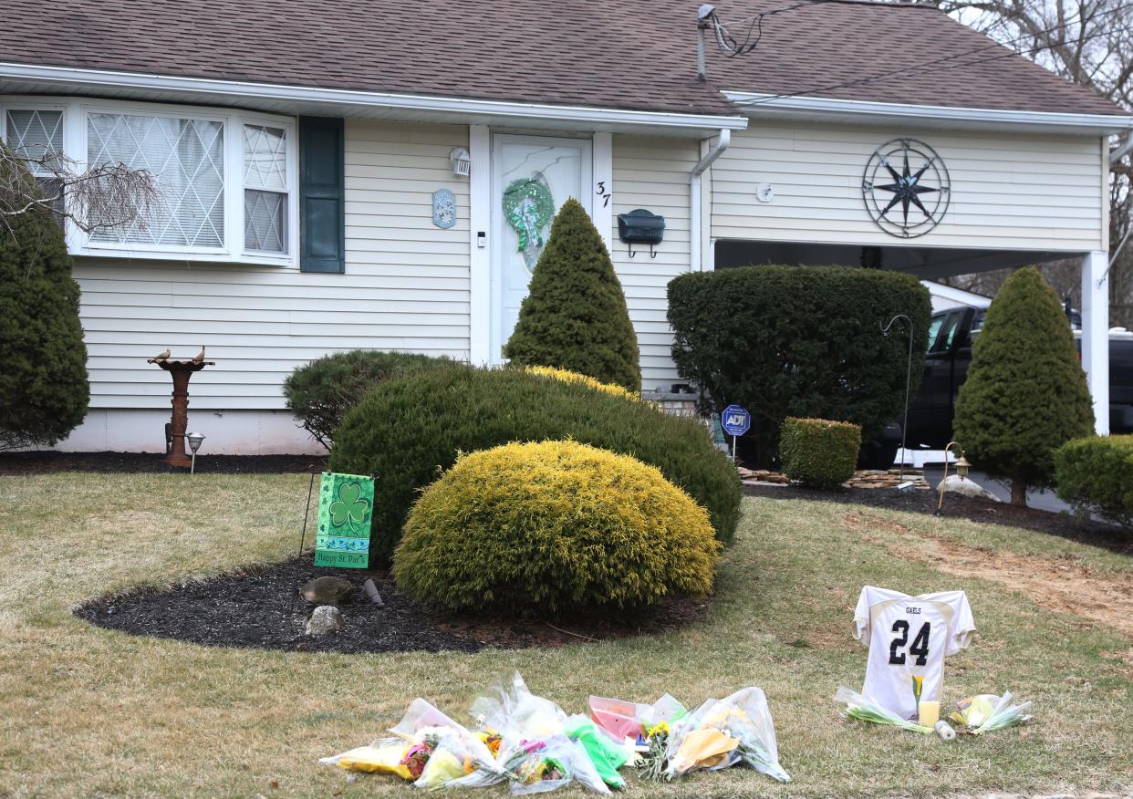 Mourners created a makeshift memorial at the Roxbury home where police say a father killed his wife and 15 year-old son before taking his own life. The scene on Friday, March 10, three days after their deaths.