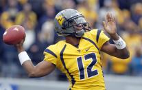 Geno Smith #12 of the West Virginia Mountaineers drops back to pass against the TCU Horned Frogs during the game on November 3, 2012 at Mountaineer Field in Morgantown, West Virginia. (Photo by Justin K. Aller/Getty Images)