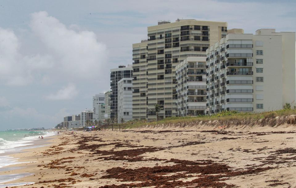 The twin Ocean Towers condominiums (from right) and the twin Islandia condominiums are seen along the shoreline looking southward, along with others, in the 9000 block of State Road A1A on Thursday, June 1, 2021, on Hutchinson Island in St. Lucie County. Many condominium residents are asking questions about the safety of their buildings. There are nearly 60 high-rise condos (3 stories or above) in St. Lucie County scattered along Hutchinson Island, and majority of those high rises are between 30 and 40 years old, according to county officials.
