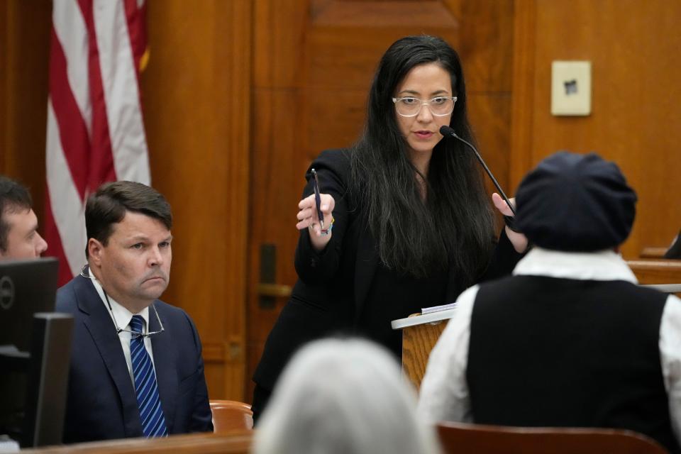 Attorney Paloma Wu, with the Mississippi Center For Justice, center, questions plaintiff Ann Saunders, right, during a hearing, Wednesday, May 10, 2023, in Hinds County Chancery Court in Jackson, Miss., where a judge heard arguments about a Mississippi law that would create a court system with judges who would be appointed rather than elected. Co-counsel attorney Cliff Johnson, of the MacArthur Justice Center, is seated to the left.