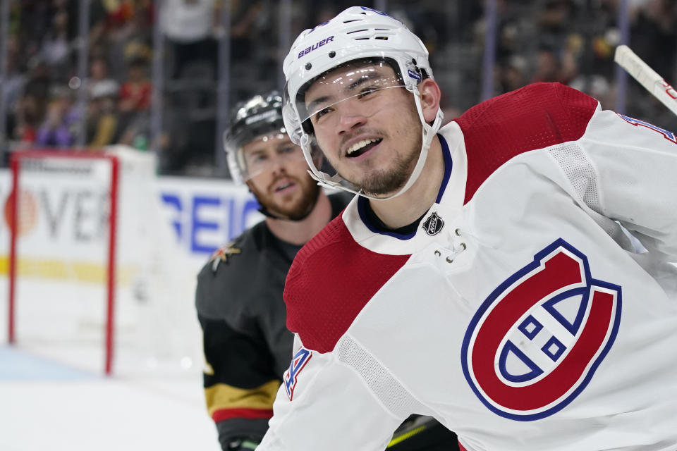 Montreal Canadiens center Nick Suzuki celebrates his open net goal during the third period in Game 5 of an NHL hockey Stanley Cup semifinal playoff series against the Vegas Golden Knights Tuesday, June 22, 2021, in Las Vegas. The Canadiens won 4-1. (AP Photo/John Locher)