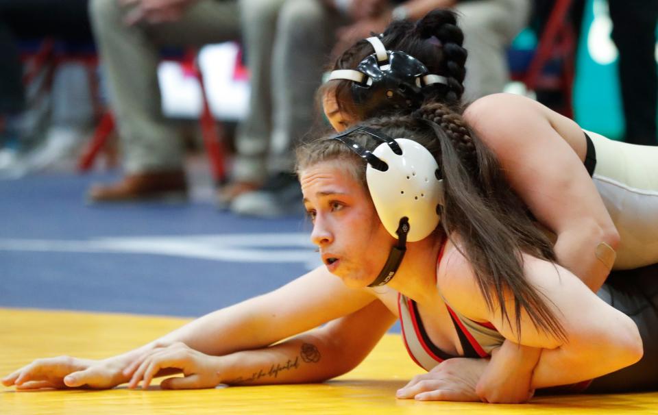 West Lafayette’s Isabel Kaplan wrestles New Haven’s Ysabelle Ocampo in the 115-pound bout, Friday, Jan. 12, 2024, during the Indiana High School Girls Wrestling state finals at Memorial Gymnasium in Kokomo, Ind.