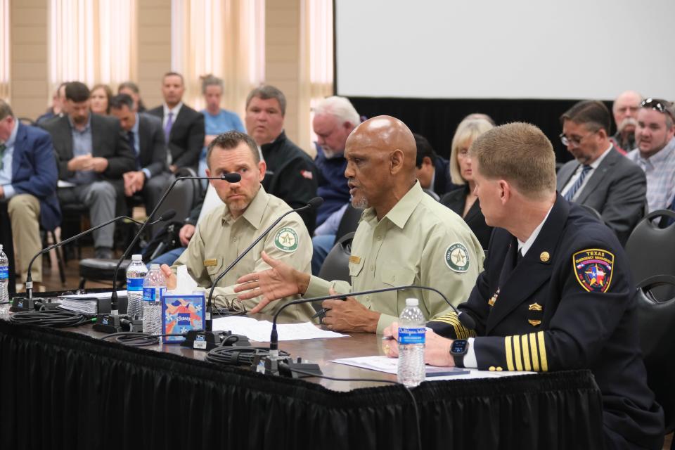 Al Davis (center), the director of the Texas A&M Forest Service, addresses the Panhandle Wildfire Investigative Committee Tuesday in Pampa.