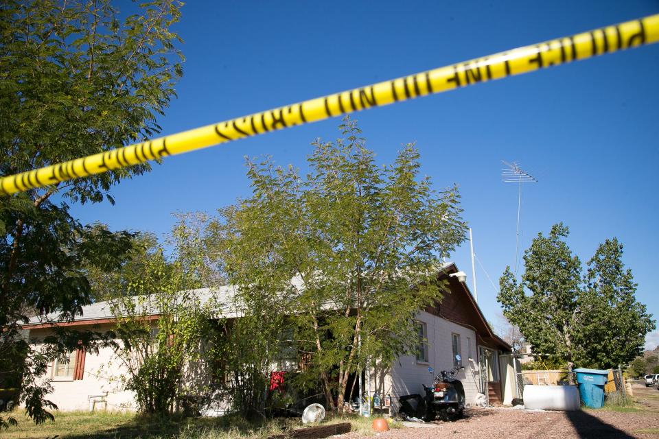 Phoenix investigators on Jan. 14, 2015, look through Bryan Patrick Miller's home.