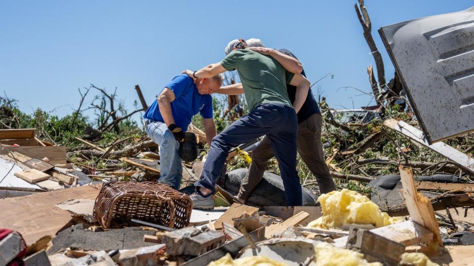 PHOTO: Billy Moles, is prayed for after his home was destroyed by a tornado on May 7, 2024, in Barnsdall, Okla. Barnsdall, a town with a population of approximately 1,000 people, was struck by an EF3 tornado. (Brandon Bell/Getty Images)