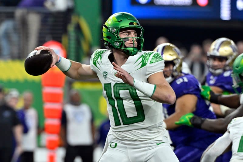 FILE - Oregon quarterback Bo Nix looks to pass against Washington during the first half of the Pac-12 championship NCAA college football game Dec. 1, 2023, in Las Vegas. The Denver Broncos drafted former Nix with the 12th pick in the NFL draft Thursday night, April 25, 2024. | David Becker