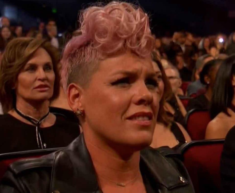 Pink has denied she was grimacing during Christina Aguilera's Whitney Houston tribute at the AMAs. Source: ABC