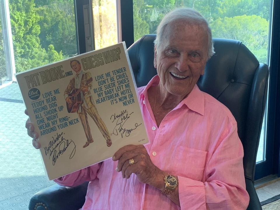 Pat Boone, with an Elvis-autographed copy of his 1964 Elvis tribute album (to which Pat Boone added his own autograph).