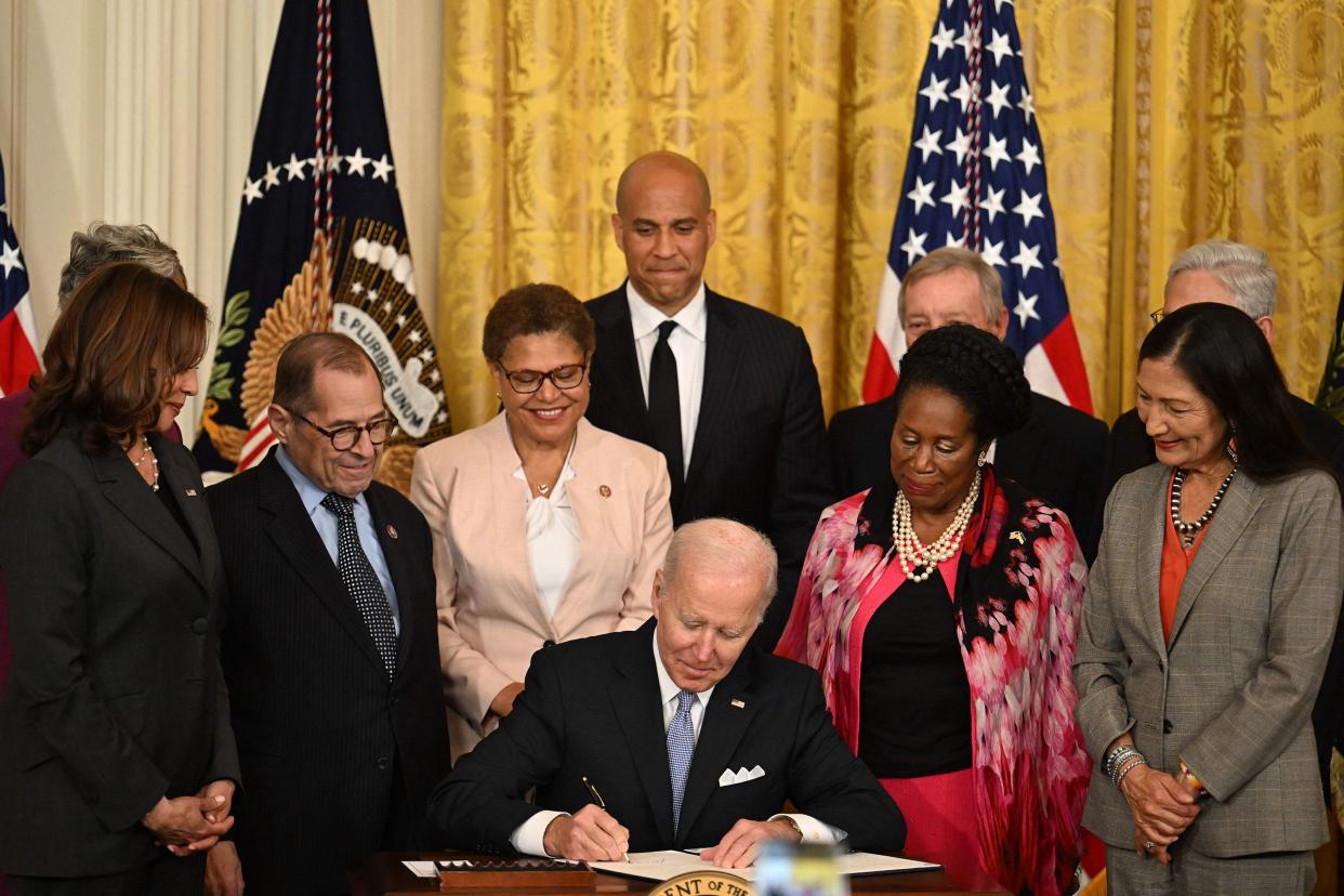U.S. President Joe Biden (C) participates in a signing ceremony in the East Room of the White House in Washington, DC on May 25, 2022. Biden signed an Executive Order to advance policing and strengthen public safety.