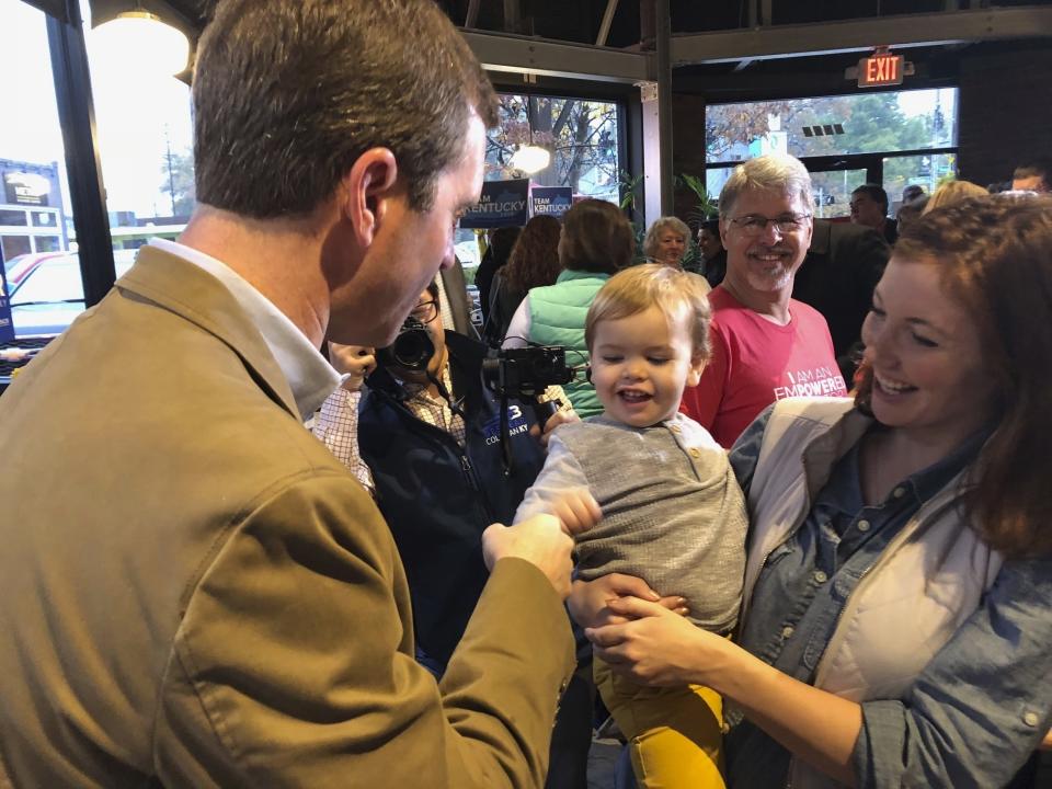 Democratic gubernatorial candidate Andy Beshear mingles with the crowd at a Louisville, Ky., coffeehouse, where he started his statewide bus tour on Wednesday, Oct. 30, 2019. Beshear, the state’s attorney general, is challenging Republican Gov. Matt Bevin in next Tuesday’s election in Kentucky. (AP Photo/Bruce Schreiner)