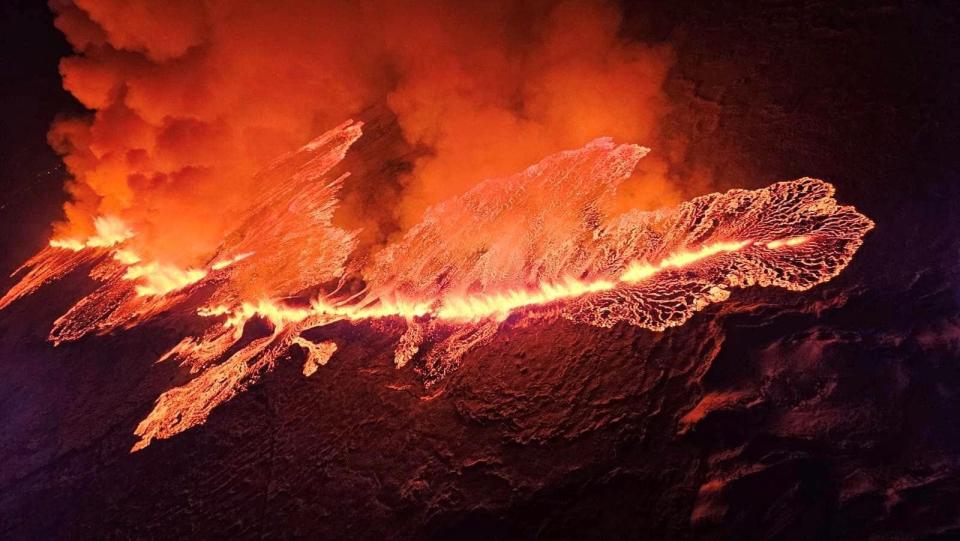 An erupting volcano spews lava and smoke, north of Grindavik, Reykjanes Peninsula, Iceland, on December 19, 2023.