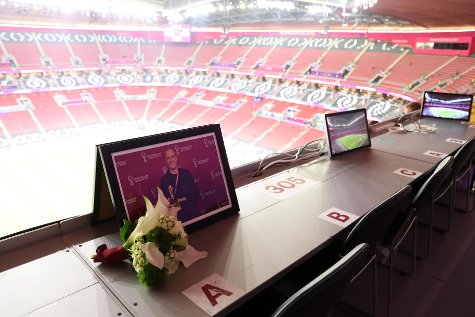Flowers are placed in memory of Grant Wahl prior to the FIFA World Cup Qatar 2022 quarter final match between England and France at Al Bayt Stadium on December 10, 2022, in Qatar. / Credit: Getty Images
