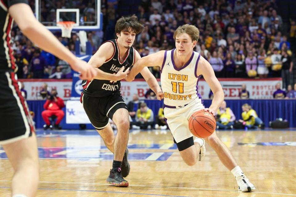 Lyon County’s Travis Perry (11) dribbles against Harlan County during the KHSAA UK HealthCare Boys’ Sweet 16 championship game at Rupp Arena in Lexington, Ky, Saturday, March 23, 2024.