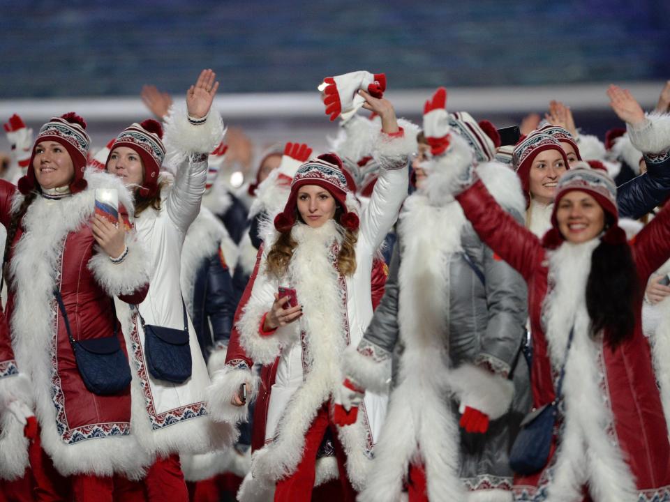 Russia's team at the 2014 Olympics wearing red coats and fur