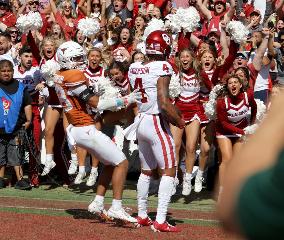 Oklahoma Sooners wide receiver Nic Anderson (4) celebrates a touchdown beside Texas Longhorns defensive back Jerrin Thompson (28) late in the fourth quarter during the Red River Rivalry college football game between the University of Oklahoma Sooners (OU) and the University of Texas (UT) Longhorns at the Cotton Bowl in Dallas, Saturday, Oct. 7, 2023. <a class="link " href="https://sports.yahoo.com/ncaaw/teams/oklahoma/" data-i13n="sec:content-canvas;subsec:anchor_text;elm:context_link" data-ylk="slk:Oklahoma;sec:content-canvas;subsec:anchor_text;elm:context_link;itc:0">Oklahoma</a> won 34-30.