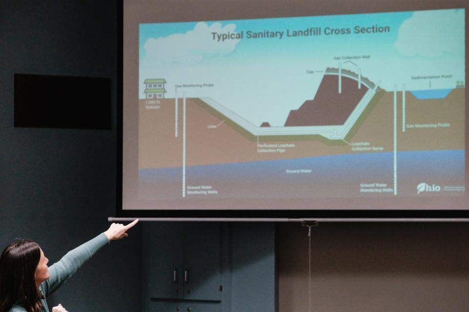 Lisa Cochran, a public information officer in the Communications and Outreach Office of the Ohio Environmental Protection Agency shows a slide during a public hearing on possible expansion of the Kimble Companies landfill located in Dover Township, Wednesday, Jan. 31 at the Dover Public Library.