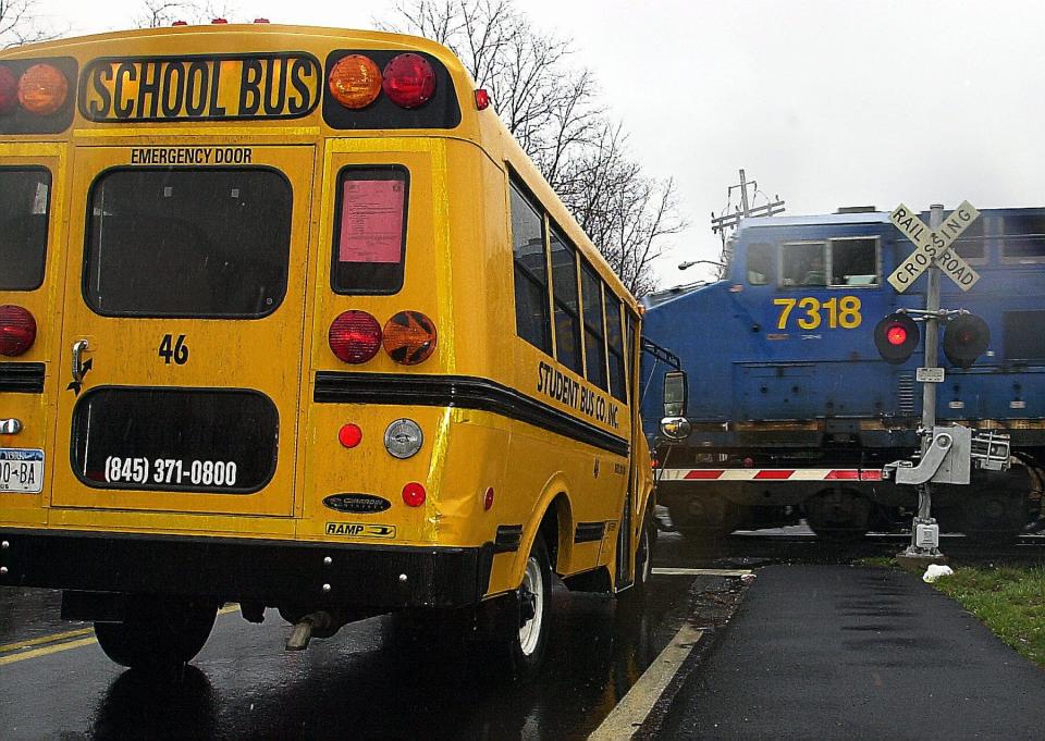 In this 2002 archive photo, a school bus stopped at the railroad crossing on Gilchrest Road in Congers where another school bus failed to stop 50 years ago. Five students died and 45 were injured when the bus was struck and dragged a quarter mile by the train. A construction detour forced bus driver Joseph Larkin to alter his route, picking up Nyack High School students on March 24, 1972.