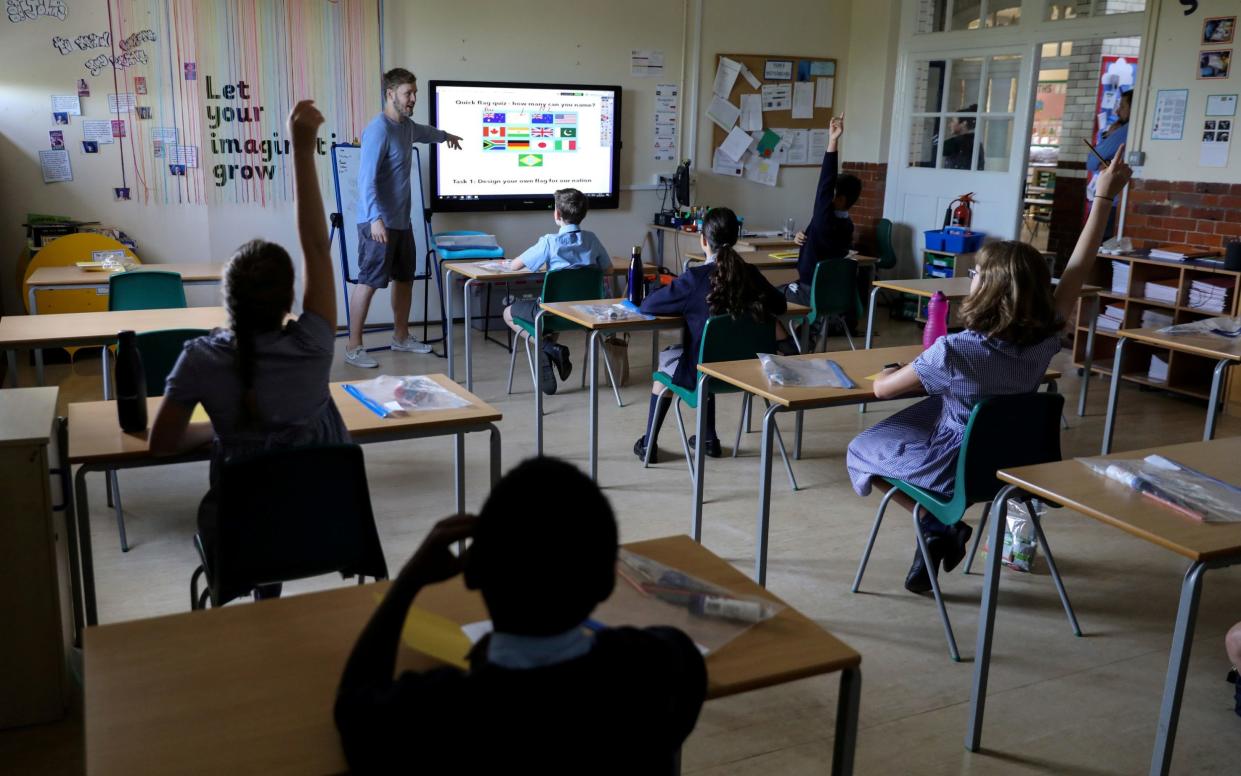 The devices will help teachers and schools monitor when there is a higher risk of virus particles being present in greater concentrations - Kevin Coombs/Reuters