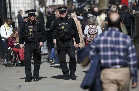 Armed police patrol the streets following the attack in Westminster earlier in the week, in central London, Britain March 26, 2017. REUTERS/Neil Hall