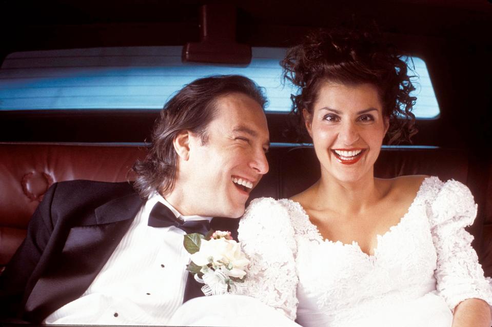 John Corbett, left, and Nia Vardalos in 2002’s breakout romantic comedy “My Big Fat Greek Wedding.”