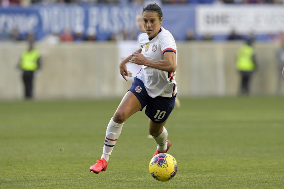 File-This March 8, 2020, file photo shows the United States forward Carli Lloyd (10) during the first half of a SheBelieves Cup soccer match against Spain in Harrison, N.J. Far from deterred by a lengthy layoff after getting her left knee scoped, Lloyd is back with a steadfast resolve as the U.S. national team pushes toward the Tokyo Olympics. (AP Photo/Bill Kostroun, File)