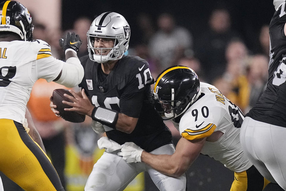 Las Vegas Raiders quarterback Jimmy Garoppolo (10) is sacked by Pittsburgh Steelers linebacker T.J. Watt (90) during the first half of an NFL football game Sunday, Sept. 24, 2023, in Las Vegas. (AP Photo/Mark J. Terrill)