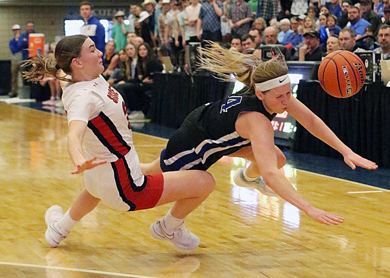 Mount Vernon-Plankinton's Emilee Fox colliedes with Sisseton's Tara Nelson during their first-round game in the state Class A girls baskeball tournament on Thursday, March 7, 2024 in the Dacotah Bank Center at Brookings.