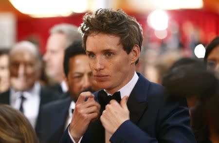 Eddie Redmayne, best actor in a supporting role nominee for his role in "The Theory of Everything," fixes his bowtie as he arrives at the 87th Academy Awards in Hollywood, California February 22, 2015. REUTERS/Lucas Jackson