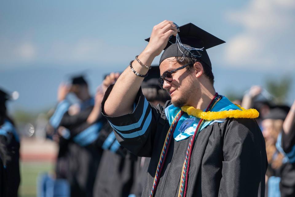 Aiden Moss moves his tassel as a graduate during the Pueblo West High School commencement ceremony on Friday, May 26, 2023.