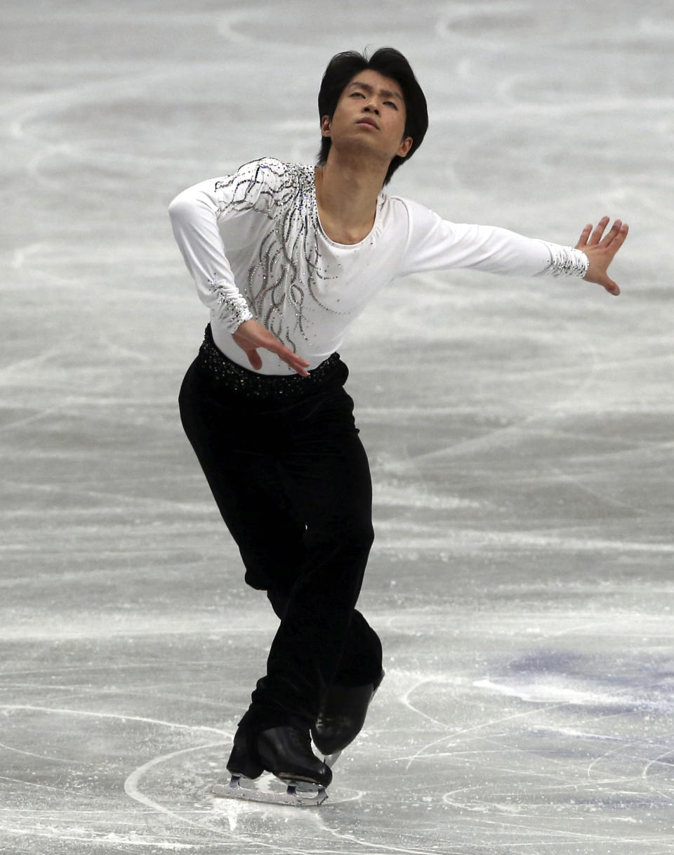 Tatsuki Machida of Japan performs during a men's short program of the World Figure Skating Championships in Saitama, near Tokyo, Wednesday, March 26, 2014. (AP Photo/Koji Sasahara)