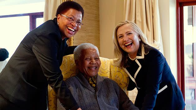 US Secretary of State Hillary Clinton poses for a photograph with Nelson Mandela and his wife Graca Machel at his home in Qunu. Photo: Reuters.