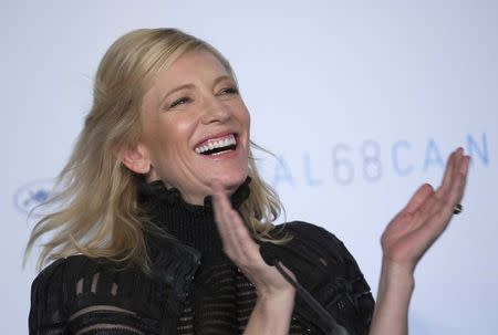 Cast member Cate Blanchett applauds as she attends a news conference for the film "Carol" in competition at the 68th Cannes Film Festival in Cannes, southern France, May 17, 2015. REUTERS/Yves Herman