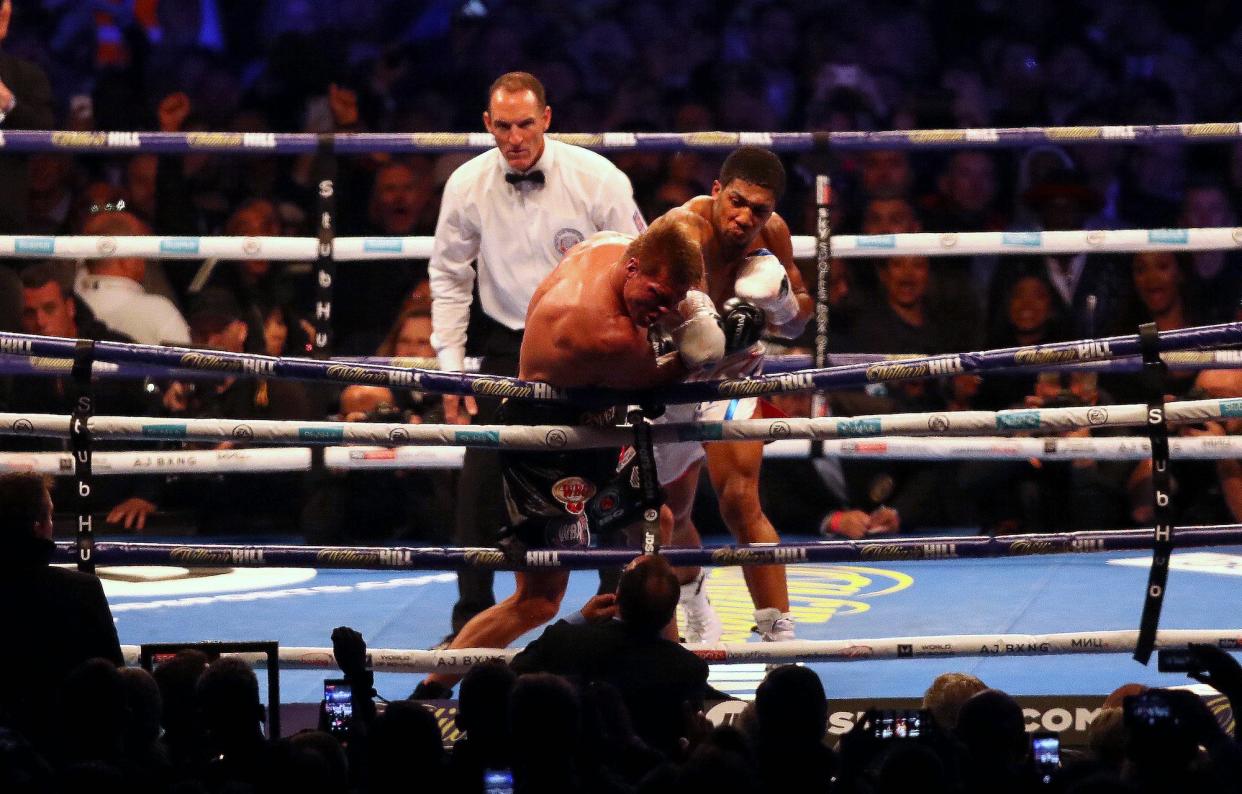 Anthony Joshua punches Alexander Povetkin