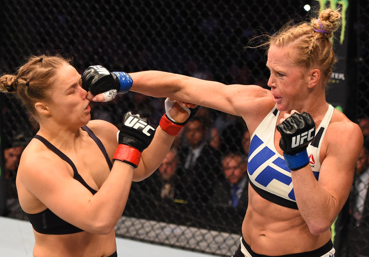 MELBOURNE, AUSTRALIA - NOVEMBER 15:  (R-L) Holly Holm of the United States punches Ronda Rousey of the United States in their UFC women's bantamweight championship bout during the UFC 193 event at Etihad Stadium on November 15, 2015 in Melbourne, Australia. (Photo by Josh Hedges/Zuffa LLC/Zuffa LLC via Getty Images)