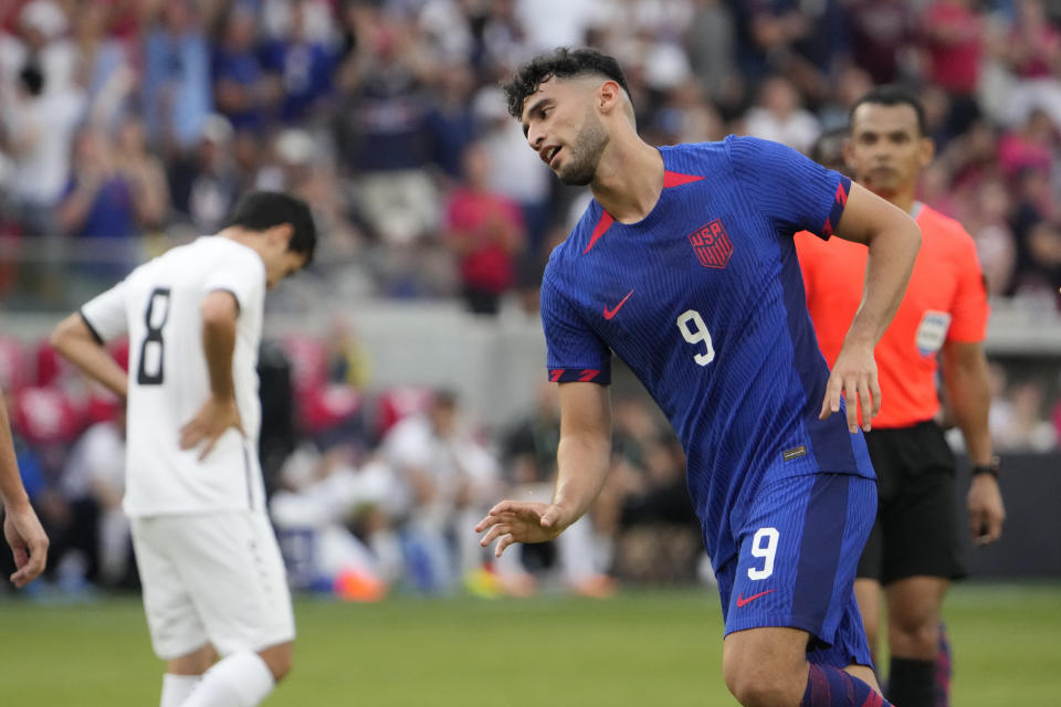 United States' Ricardo Pepi (9) celebrates after scoring as Uzbekistan's Jamshid Iskanderov (8) is seen in the background during the second half of an international friendly soccer match Saturday, Sept. 9, 2023, in St. Louis. (AP Photo/Jeff Roberson)