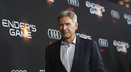 Cast member Harrison Ford poses at the premiere of "Ender's Game" at the TCL Chinese theatre in Hollywood, California October 28, 2013. REUTERS/Mario Anzuoni