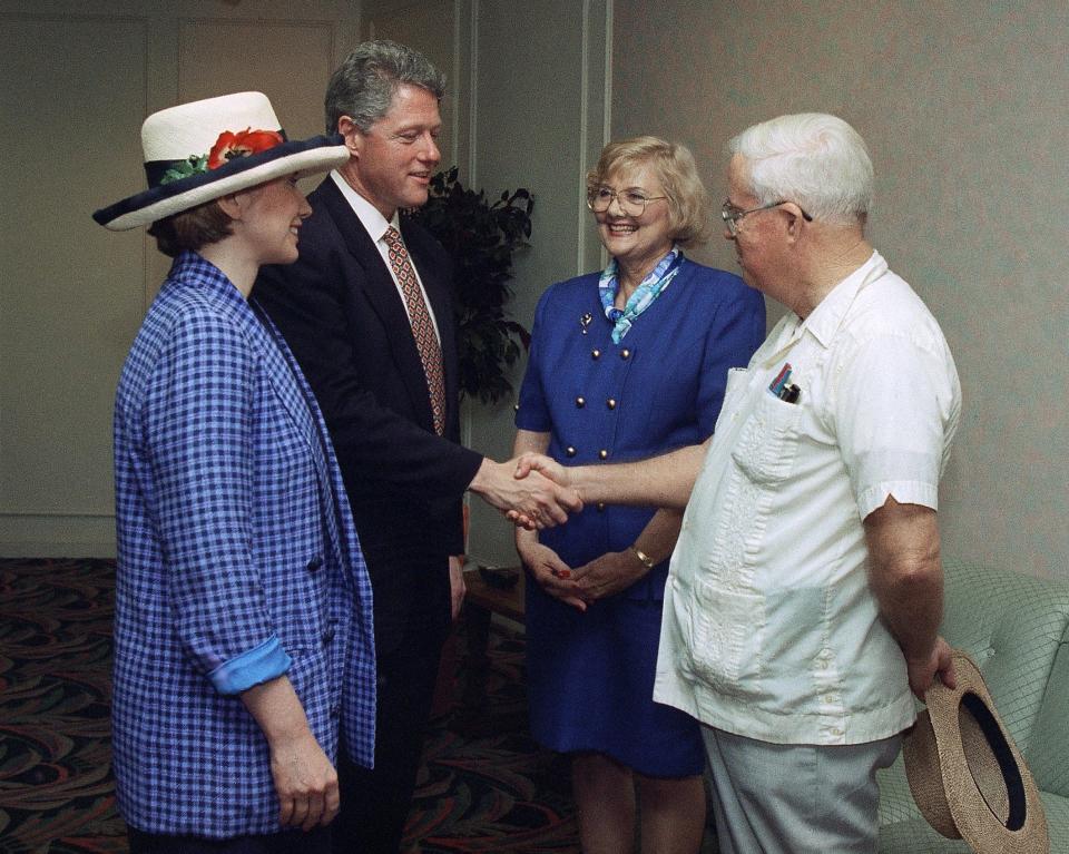 President Bill Clinton and his wife, Hillary, left, talk with Jeanne Linley, of Fort Lauderdale, and Joe Crankshaw, of Port St. Lucie, at a private meeting after Clinton arrived in Deerfield Beach, Fla., March 21, 1994 for a health care forum. Linley and Crankshaw had written the president about concerns over their situation as "caregivers". (AP Photo/Pool/Carah Thomas-Maskell)