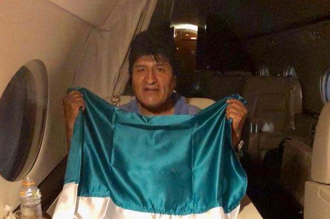 Evo Morales holds the Mexican flag as he flees his country: Twitter - Marcelo Ebrard C