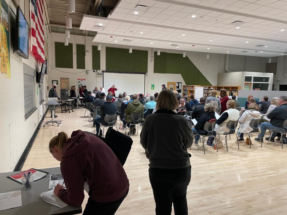 Residents sign in for a Raymond School Board meeting Nov. 20, 2023.