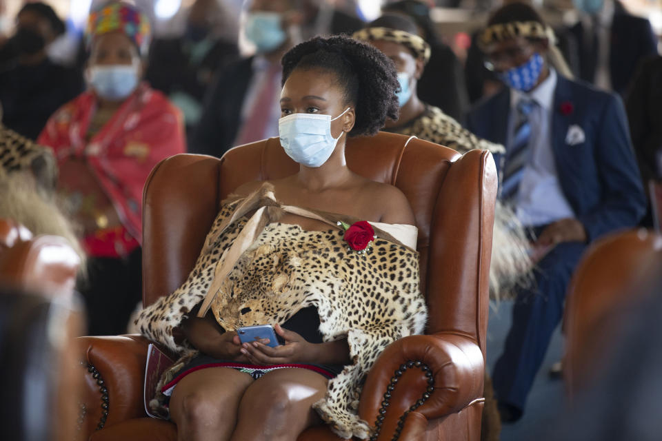 A member of the royal household attends a memorial service for Zulu King Goodwill Zwelithini in Nongoma, South Africa, Thursday, March 18, 2021. The monarch passed away early Friday after a reign that spanned more than 50 years. (AP Photo/PhilL Magakoe)