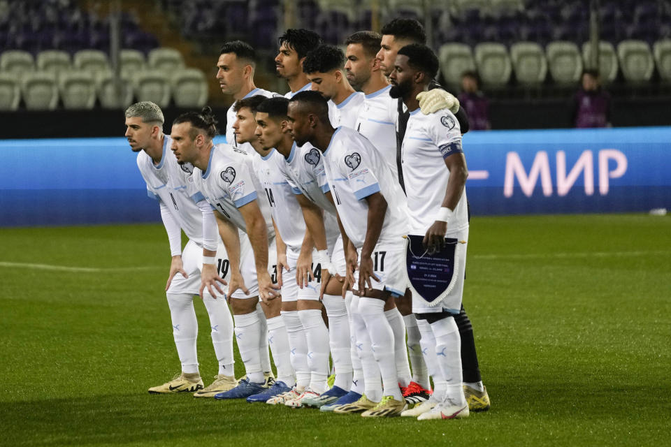 Israel players pose for photographers prior to the start of the Euro 2024 qualifying play-off soccer match between Israel and Iceland, at Szusza Ferenc Stadium in Budapest, Hungary, Thursday, March 21, 2024. (AP Photo/Darko Vojinovic)