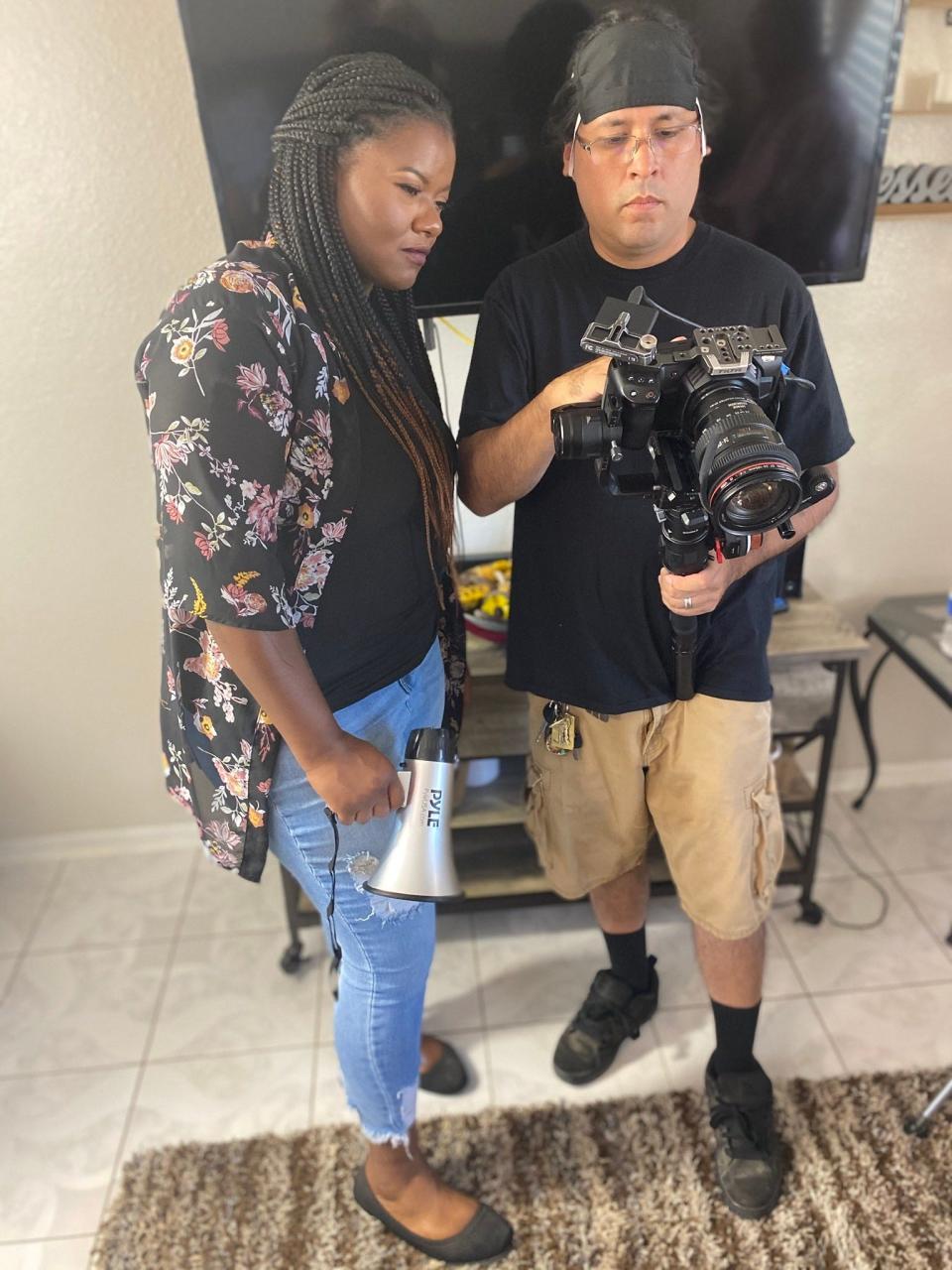 Film producer Jae Chanel and photographer Vic Mendoza review film footage. Chanel hopes that her feature film “Not A Victim” will shine a light on the issue of human sex trafficking and abuse.