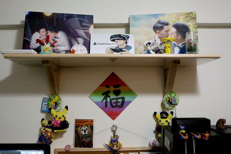 Photographs taken by Austin Haung, sit on a shelf in his studio in Taipei, Taiwan, November 11, 2018. A REUTERS/Ann Wang