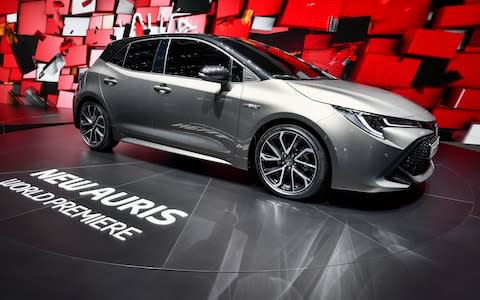 The new Toyota Auris hybrid model car is seen at the stand of Japanese carmaker during the first press day of the Geneva International Motor Show on March 6, 2018 in Geneva.  - Credit: Fabrice Coffrini/GETTY