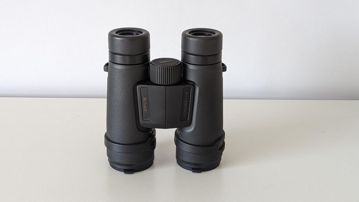  Nikon Monarch M5 12x42 binoculars on a white table. 