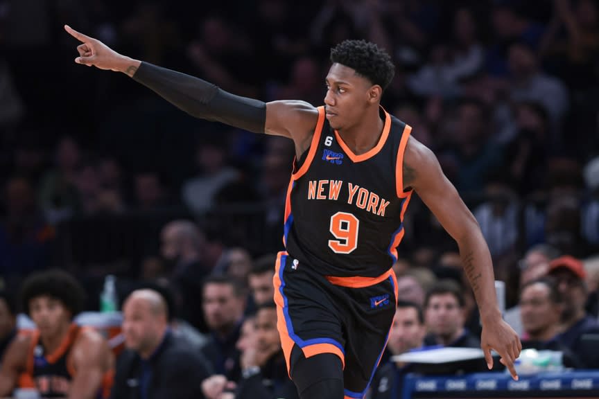 RJ Barrett pointing after making basket, City connect black uniform