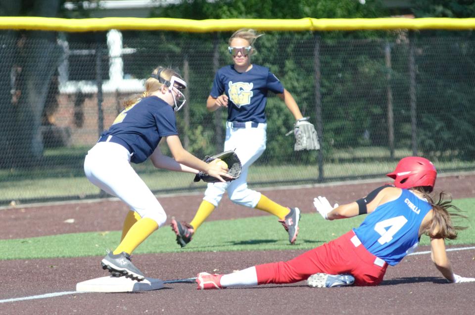 Peyton Titus looks to apply a tag during the quarterfinals of the Little League Softball Majors state tournament on Tuesday, July 12 in Grosse Pointe Woods, Mich.