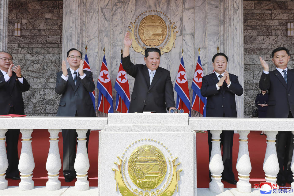 In this photo provided by the North Korean government, North Korean leader Kim Jong Un, center, attends a parade to celebrate the 110th birth anniversary of its late founder Kim Il Sung, at the Kim Il Sung Square in Pyongyang, North Korea Friday, April 15, 2022. Independent journalists were not given access to cover the event depicted in this image distributed by the North Korean government. The content of this image is as provided and cannot be independently verified. Korean language watermark on image as provided by source reads: "KCNA" which is the abbreviation for Korean Central News Agency. (Korean Central News Agency/Korea News Service via AP)