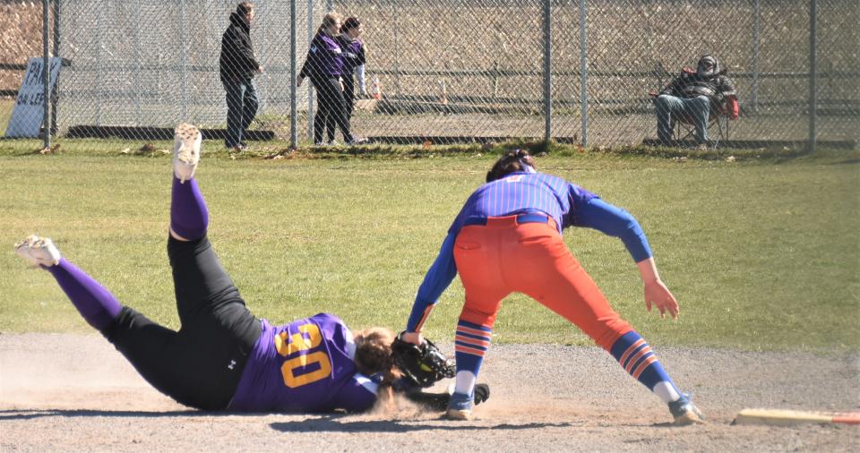 Oneida first baseman Julianna Caroli (right) tags out a Voorheesville runner who was caught off base during the Disabled American Veterans Tournament Sunday at the Mudville complex in Herkimer.