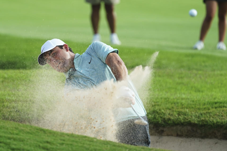 Scottie Scheffler hits out of a bunker on the eighth fairway during the third round of the Tour Championship golf tournament at East Lake Golf Club Saturday, Aug. 27, 2022, in Atlanta. (AP Photo/John Bazemore)